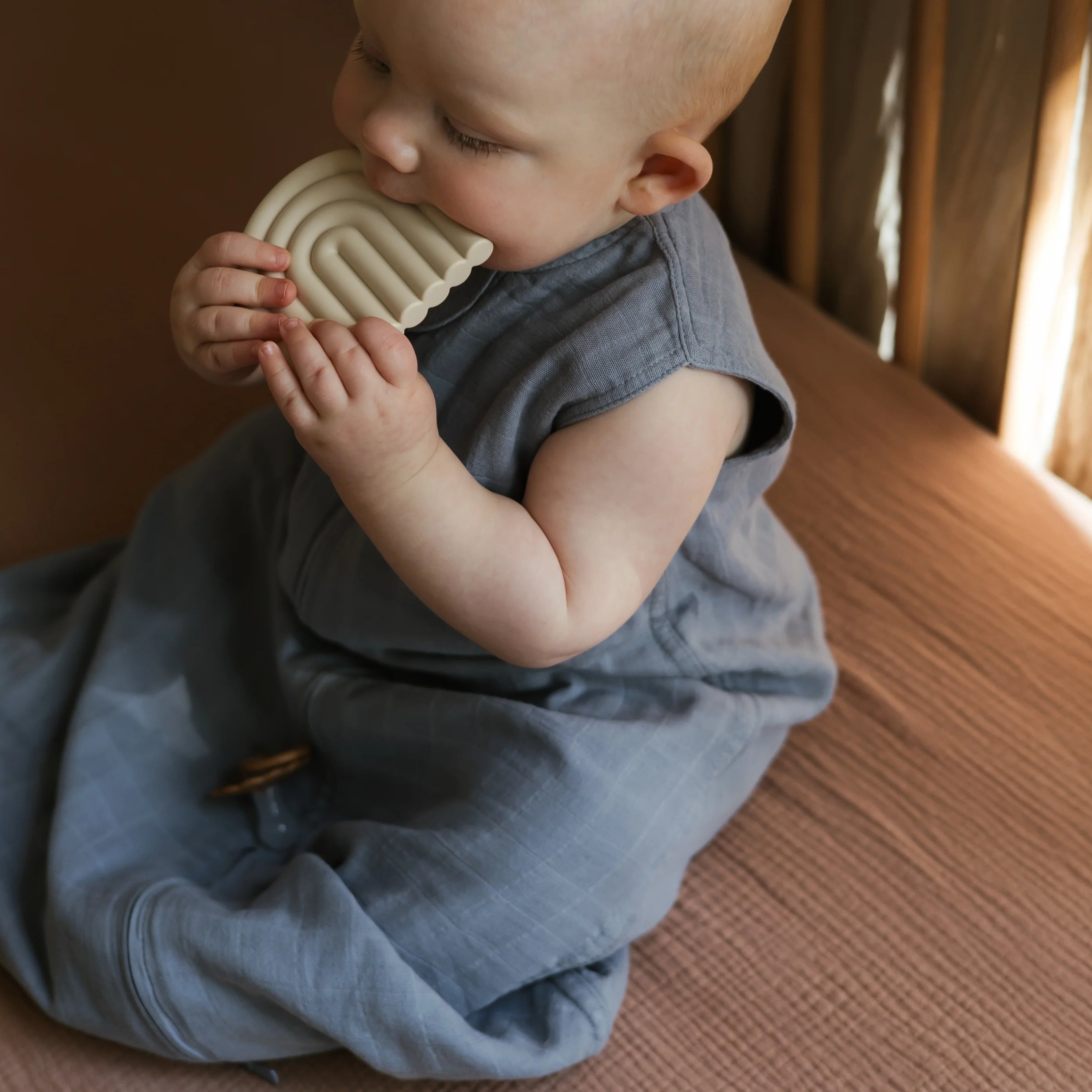 mushie-rainbow-teether-baby-shifting-sand